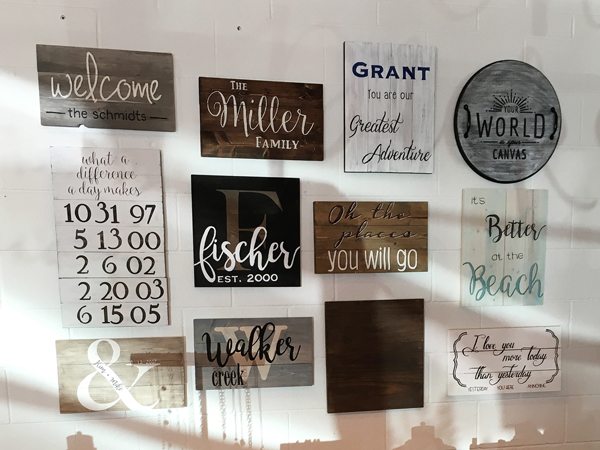 Display wall of hand-painted wood sign craft project